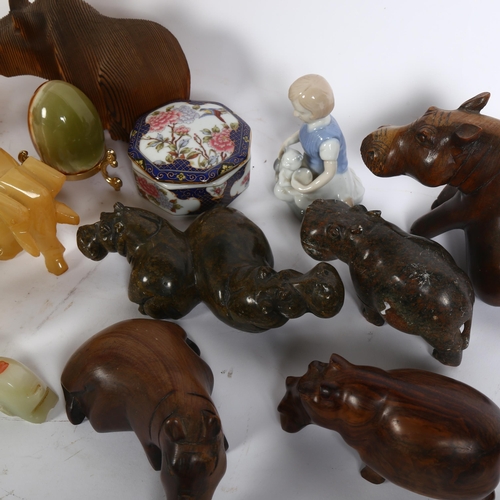 346 - A group of various soapstone, onyx, and hardwood sculptures of animals, including a large number of ... 