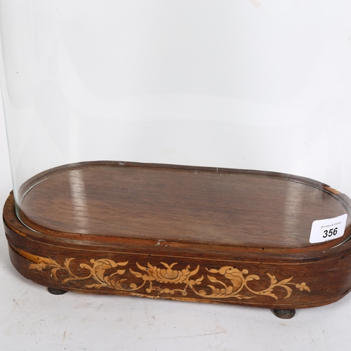 356 - A large glass dome on wooden base with inlaid decoration, H50cm, L32cm, D16cm