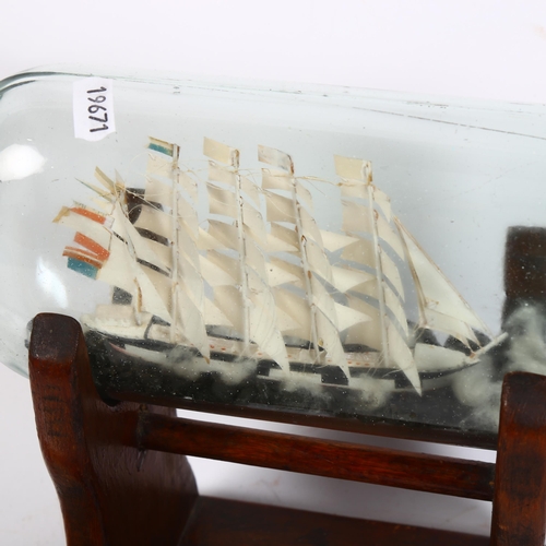 366 - 2 handmade scratch-built ship-in-bottle ornaments, 1 on raised display stand, H25cm (2)