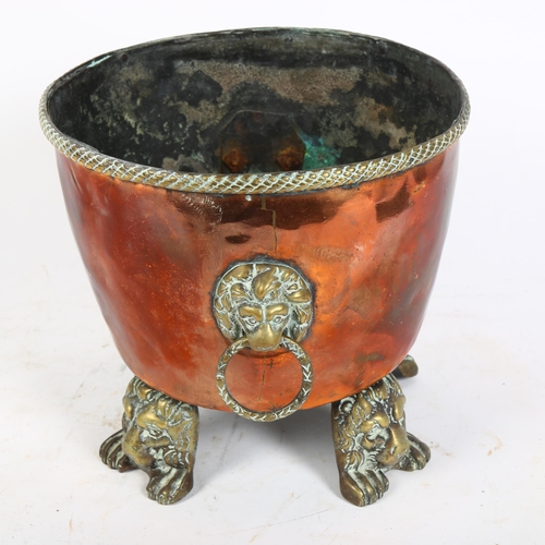 375 - Antique copper pot, with lion mask ring handles and brass lion feet, H19.5cm