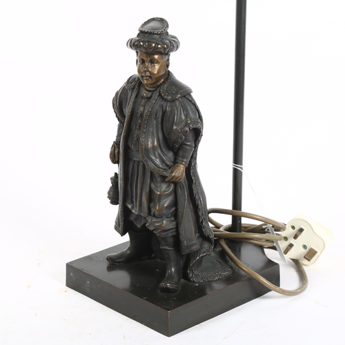 388 - A resin bronze table lamp, in the form of a merchant, on metal plinth, with shade, 60cm