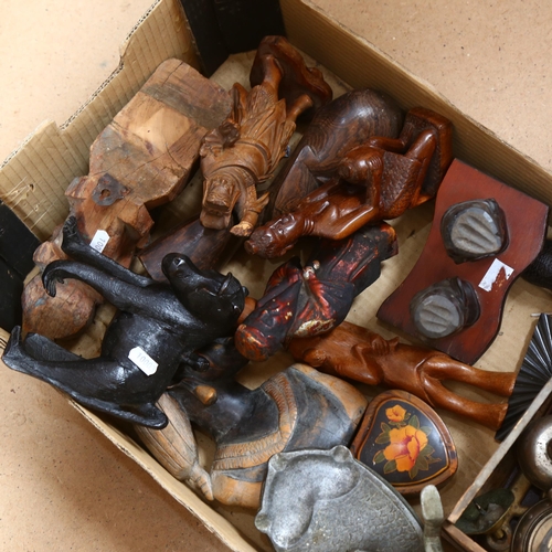 411 - A box of Ethnic carved wood figures, an Egyptian ashtray, lamp etc