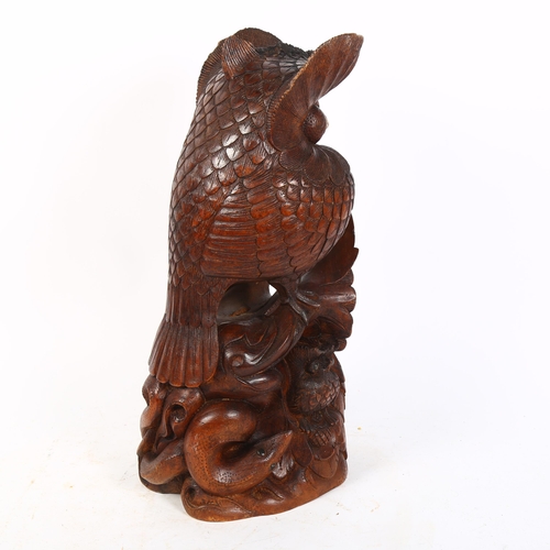 432 - A Vintage African carved wood group of owls and a snake, H41.5cm, signed