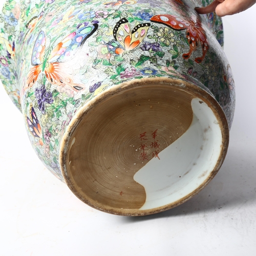 462 - A large Chinese porcelain bowl, decorated with butterflies, 6 character mark, diameter 47cm