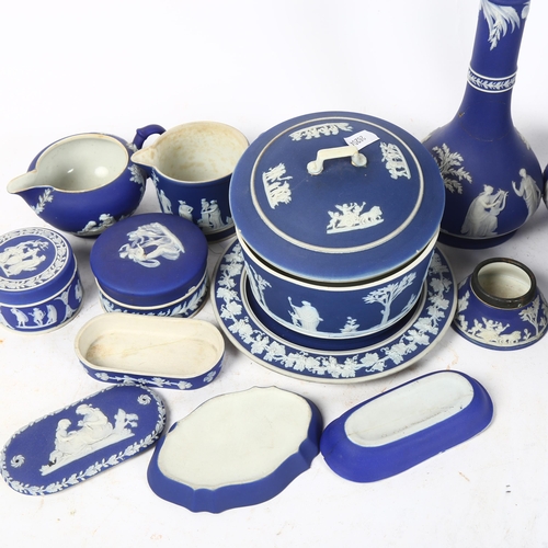 467 - A group of 19th century and later Wedgwood dark blue Jasperware items, including jugs, boxes, pair o... 