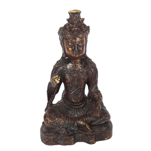 483 - A patinated cast-brass seated Buddha, 21cm