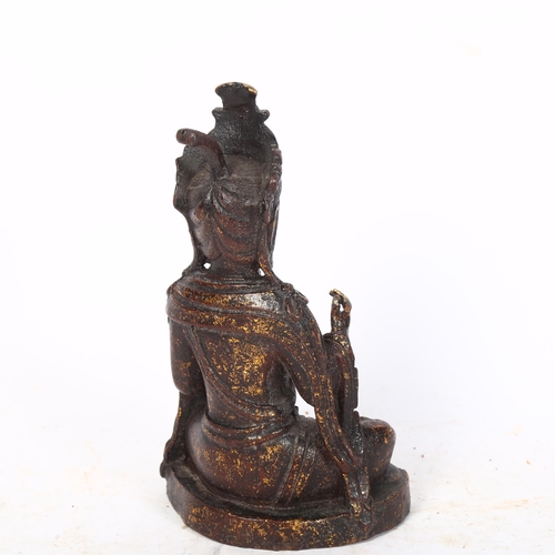 483 - A patinated cast-brass seated Buddha, 21cm