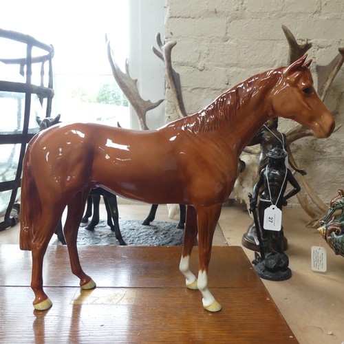 112 - A large Beswick model of a chestnut horse, H29cm