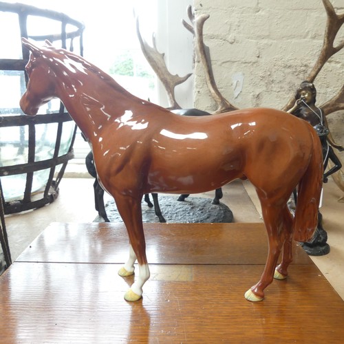 112 - A large Beswick model of a chestnut horse, H29cm