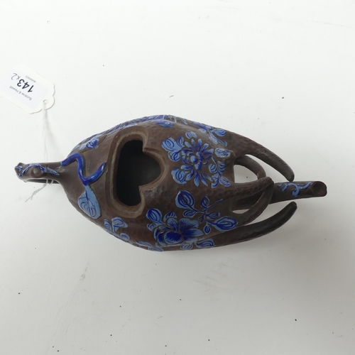 143 - A Chinese terracotta teapot in the form of a gourd, with blue enamel painted decoration, L19cm, and ... 