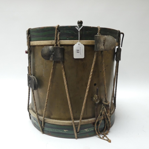 22 - A 20th century military drum, with brass body and painted wood mounts, H38cm, D37cm, and a pair of d... 