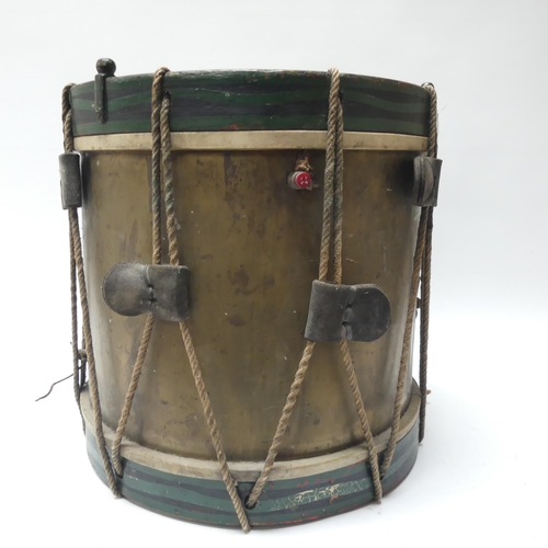 22 - A 20th century military drum, with brass body and painted wood mounts, H38cm, D37cm, and a pair of d... 