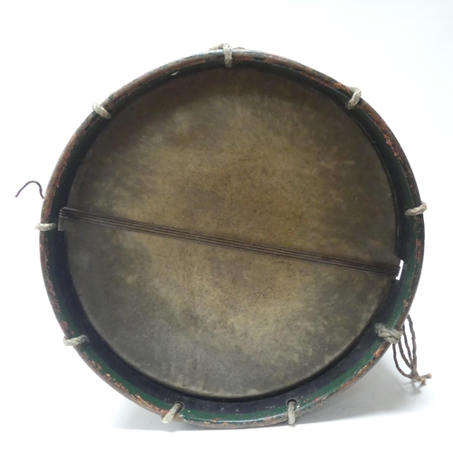 22 - A 20th century military drum, with brass body and painted wood mounts, H38cm, D37cm, and a pair of d... 