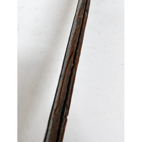 56 - An Indo-Persian short curved sword with steel guard and carved wood handle, together with leather sc... 