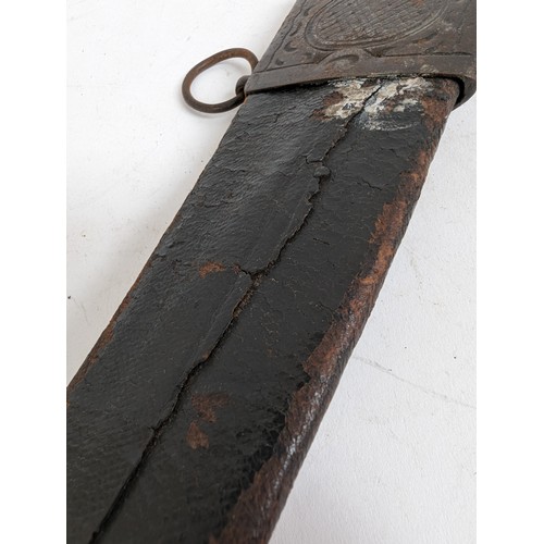 56 - An Indo-Persian short curved sword with steel guard and carved wood handle, together with leather sc... 