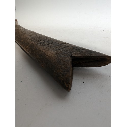 58 - An Indian Tulwar sword with wooden scabbard, blade length 87cm, overall length approx 100cm