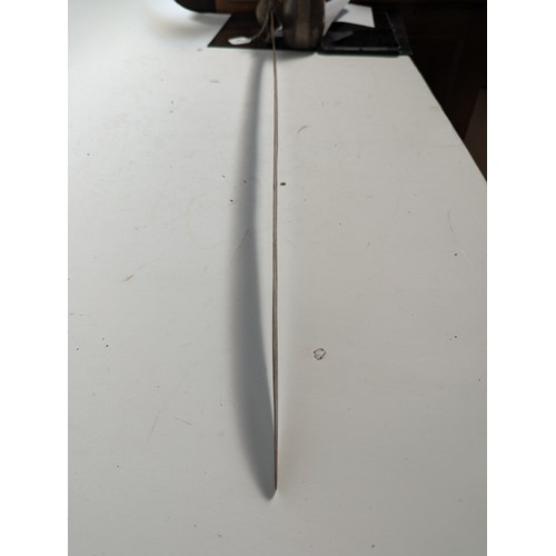 58 - An Indian Tulwar sword with wooden scabbard, blade length 87cm, overall length approx 100cm