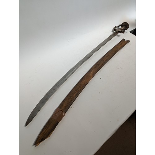 58 - An Indian Tulwar sword with wooden scabbard, blade length 87cm, overall length approx 100cm