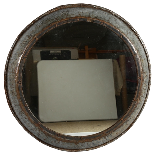 82 - A large vintage hand made steel framed round mirror, diameter 90cm