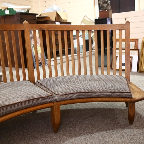 10 - Guillerme et Chambron, France, a 1960s curved oak bench sofa, length 198cm, depth approx 86cm, seat ... 