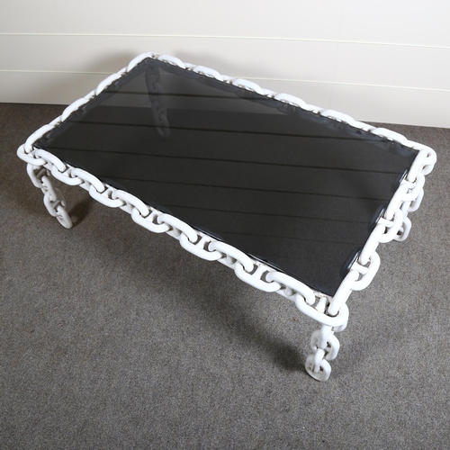 114 - A 1970s Belgian Brutalist coffee table, the smoked glass top on heavy chain base, top 106 x 60cm, he... 