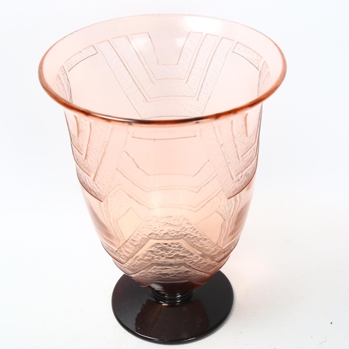 121 - A 1920s' Schneider blush glass vase, with raised geometric panels, signed to rim of foot, height 21.... 