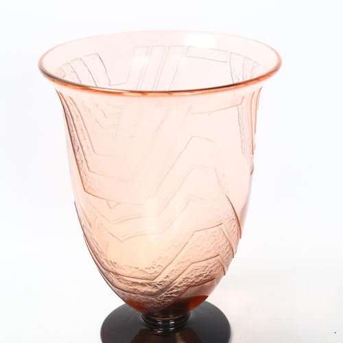 121 - A 1920s' Schneider blush glass vase, with raised geometric panels, signed to rim of foot, height 21.... 