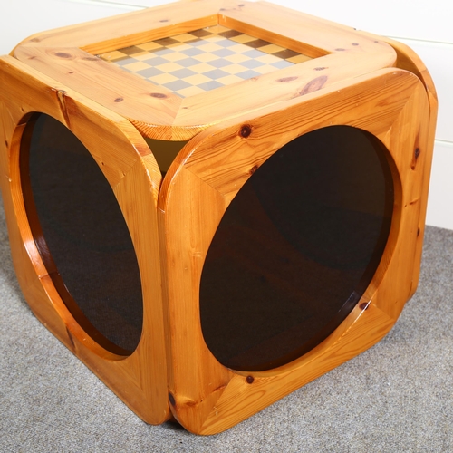 28 - A 1970s pine chess table, the sides with circular smoked perspex panels, top 51.5cm Sq, height 50cm