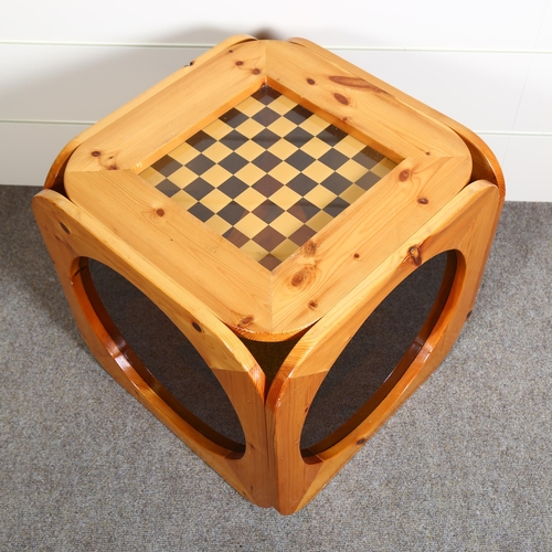 28 - A 1970s pine chess table, the sides with circular smoked perspex panels, top 51.5cm Sq, height 50cm