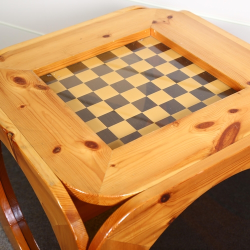 28 - A 1970s pine chess table, the sides with circular smoked perspex panels, top 51.5cm Sq, height 50cm