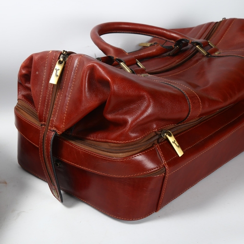 29 - Jacob Fine Leather, a pair of burgundy leather weekend bags, one with original label