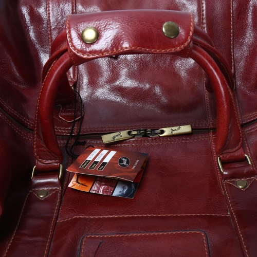 29 - Jacob Fine Leather, a pair of burgundy leather weekend bags, one with original label