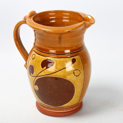 34 - Attributed Norah Braden (1901-2001), an earthenware jug with slip decoration, makers mark to base, h... 