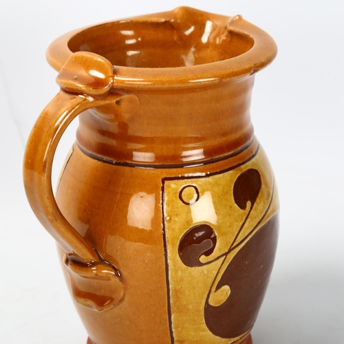 34 - Attributed Norah Braden (1901-2001), an earthenware jug with slip decoration, makers mark to base, h... 