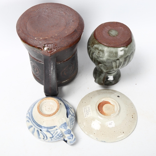 73 - 3 pieces of Studio pottery, Seth Cardew cup and saucer and a large Abuja pottery tankard, both with ... 