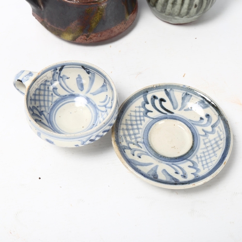 73 - 3 pieces of Studio pottery, Seth Cardew cup and saucer and a large Abuja pottery tankard, both with ... 