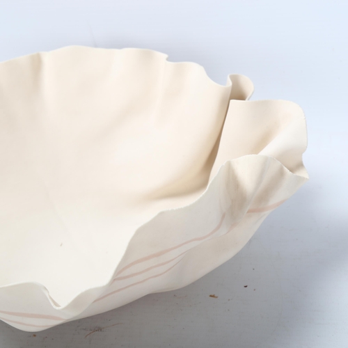 78 - Roma Babuniak, a studio ceramic porcelain bowl with crumpled edge, 1988, poured porcelain strip deco... 