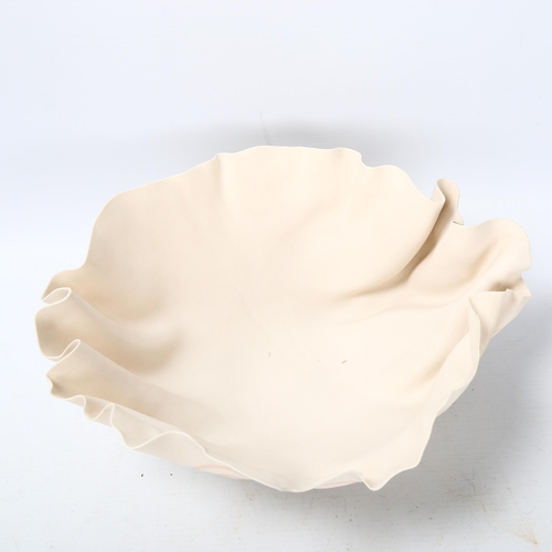 78 - Roma Babuniak, a studio ceramic porcelain bowl with crumpled edge, 1988, poured porcelain strip deco... 