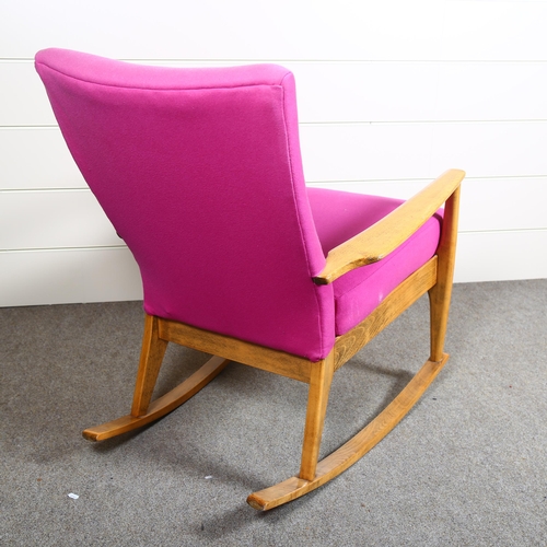 9 - A 1950s/60s Parker Knoll model PK988 rocking chair, upholstered in purple wool fabric, makers stamp ... 