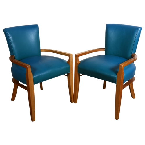 115 - A pair of Design America Spinneybeck Knickerbocker Handrail chairs in the manner of Gilbert Rohde, K... 