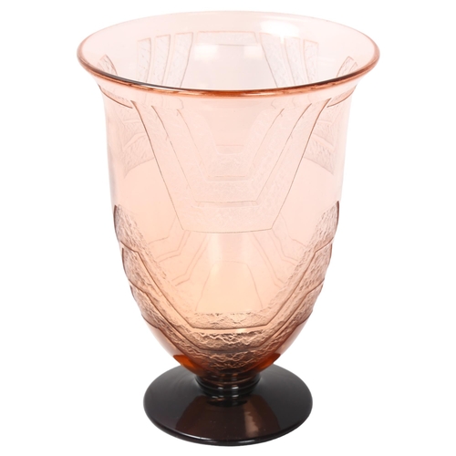 121 - A 1920s' Schneider blush glass vase, with raised geometric panels, signed to rim of foot, height 21.... 