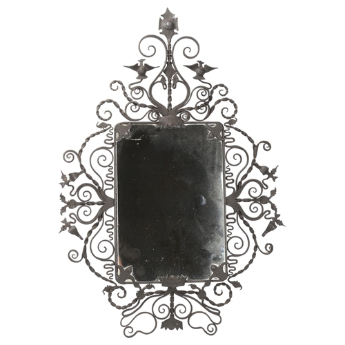 76 - A mid-century wrought iron wall hanging mirror with intricate bird and foliage decoration, height of... 