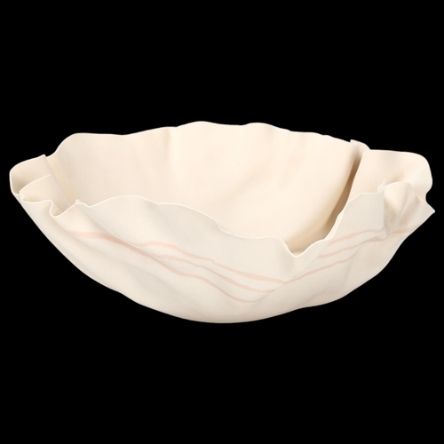 78 - Roma Babuniak, a studio ceramic porcelain bowl with crumpled edge, 1988, poured porcelain strip deco... 