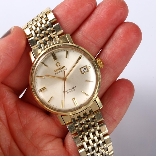 1003 - OMEGA - a gold plated stainless steel Seamaster De Ville automatic bracelet watch, silvered dial wit... 