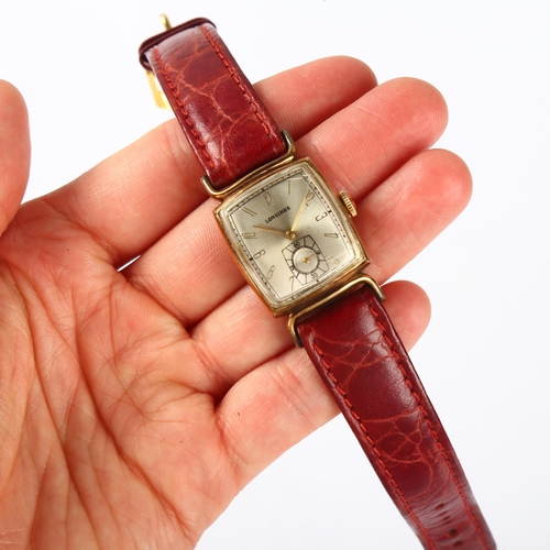 1009 - LONGINES - a 10k gold filled mechanical wristwatch, circa 1940s, silvered cushion-shaped dial with a... 