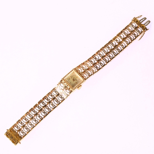 1020 - LUCIEN PICCARD - a lady's 14ct gold mechanical bracelet watch, silvered dial with applied gilt hour ... 