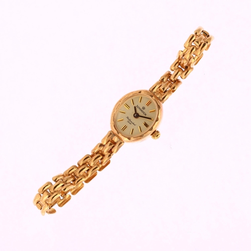 1030 - SOVEREIGN - a lady's 9ct gold quartz bracelet watch, silvered dial with applied gilt baton hour mark... 