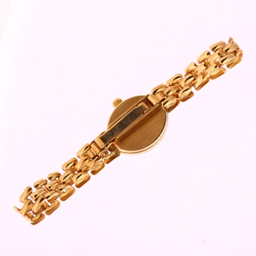 1030 - SOVEREIGN - a lady's 9ct gold quartz bracelet watch, silvered dial with applied gilt baton hour mark... 