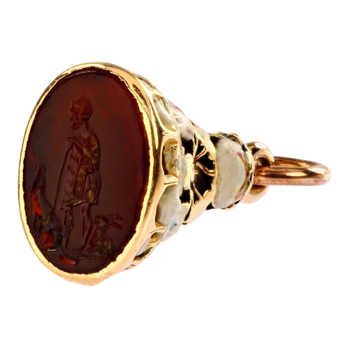 A Georgian gold enamel and carnelian 'Hermit, Dog and Rabbit' fob seal, intaglio carved with legend figures, set within unmarked gold and polychrome enamel frame, seal 11.7 x 9.4mm, fob height excluding bale 17.3mm, 2.2g