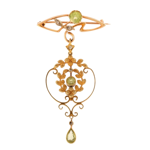 1102 - An Edwardian Art Nouveau 15ct gold peridot and diamond openwork drop brooch, set with pear and round... 